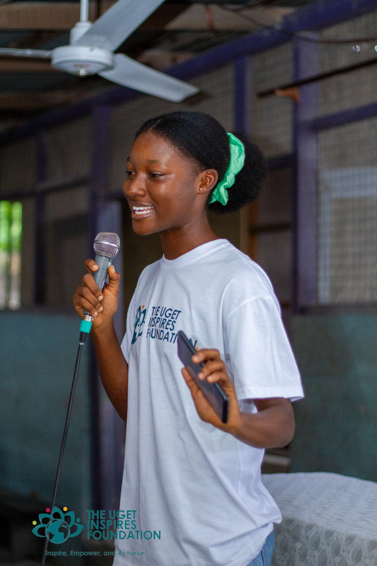 Young speaker sharing her voice at a Uget Inspires Foundation event