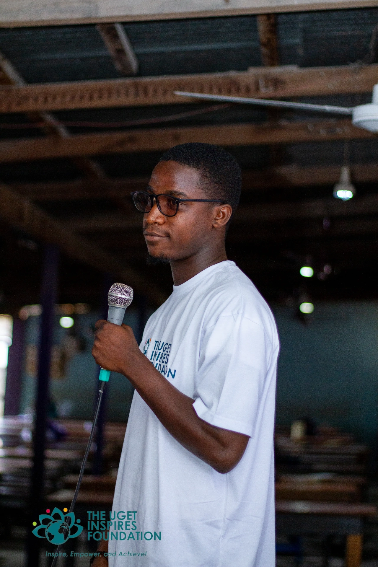 Uget Inspires Foundation volunteer addressing the community
